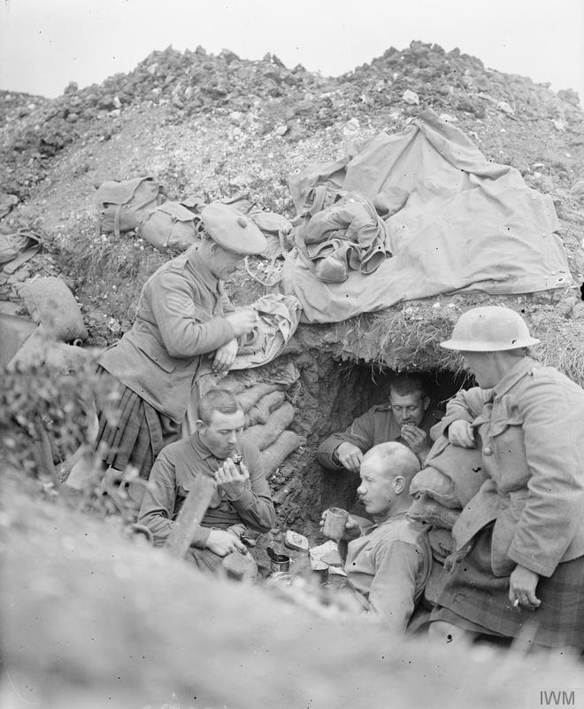 Kilted Troops resting in a dugout on the Western Front of WWI