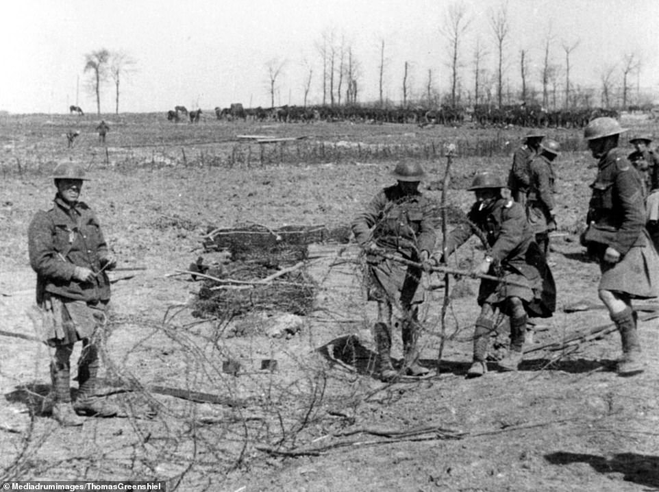 Gordon Highlanders preparing barbed wire entanglements